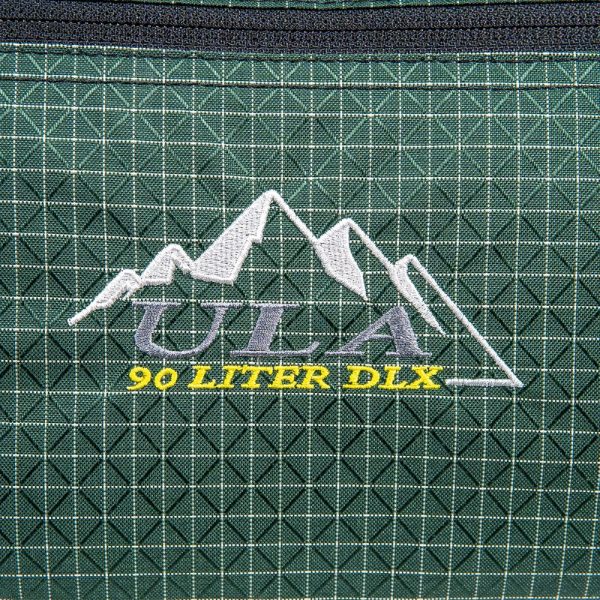 A close up of the ULA logo on the side of a ULA DLX Duffle Bag.