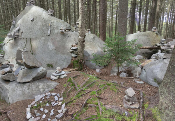A group of balanced rock piles and rock art on the Appalachian Trail