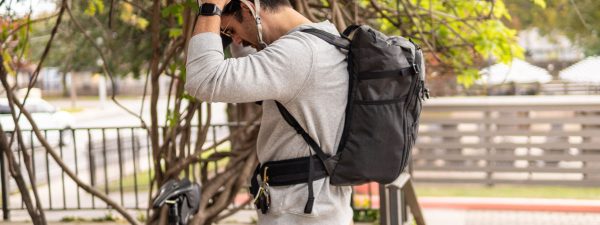 An urban explorer wears a Dragonfly with a Dragonfly + Packrat Hipbelt attached (sold separately.)