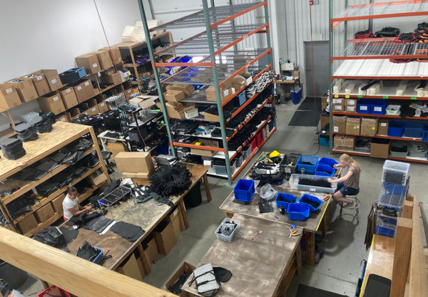 A birds eye view of the shop, showing the cutting tables and shelves of packs ready to roll!