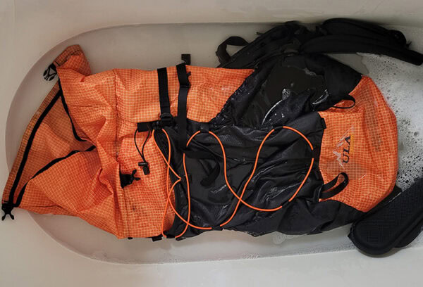 A ULA Backpack in a bathtup full of water.