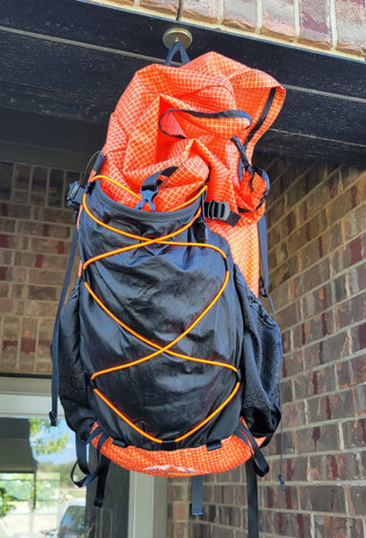 A recently washed ULA backpack hang dries outside