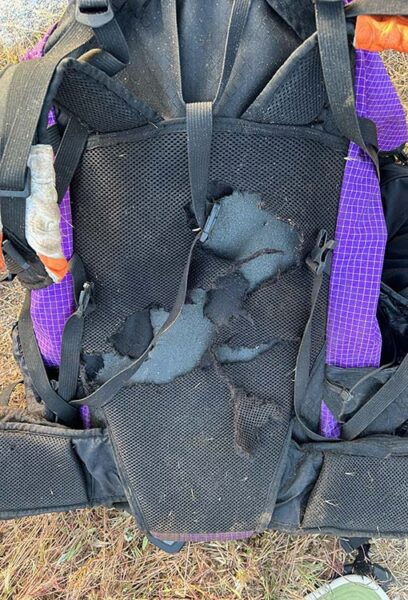 A ULA Pack that looks like a bear or a rabid squirrel decided to eat the padded back frame. It needs to go to ULA for repaires.
