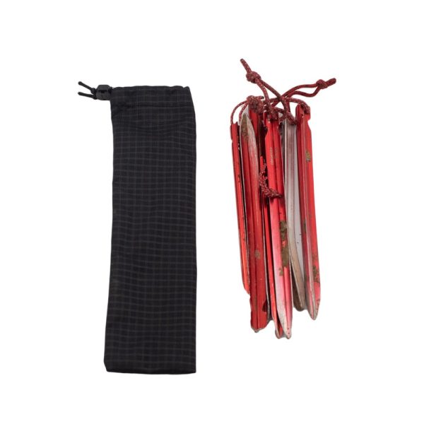 ULA ultralight tent stake bag with stakes beside it