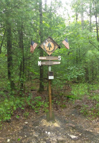 The Appalachian Trail halfway sign post saying Springer Mountain is 1,090.5 miles south and Mt. Katahdin is 1090.5 miles North.