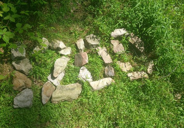 Mile 1200 written oput on the ground in rocks.