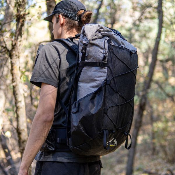 A backpacker wears the ultralight ULTRA Circuit SV on a trail in Logan, Utah.