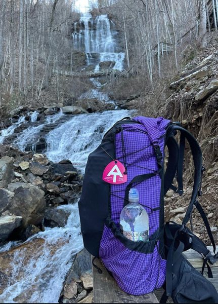A purple robic ULA backpack sits next to a waterfall on the Appalachian Trail.