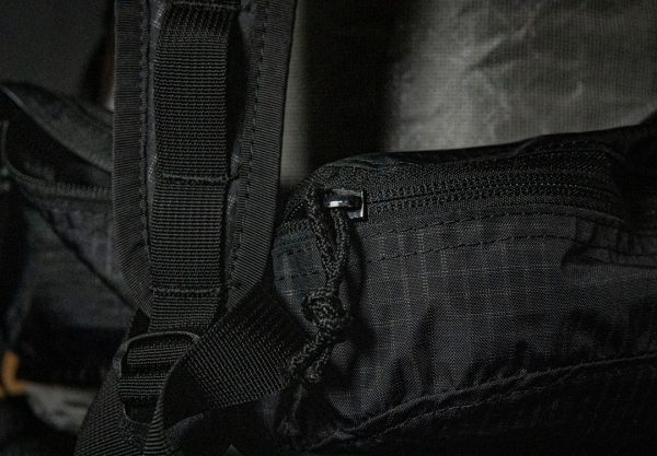 A close up of the zipper on the hipbelt pockets of the Nexus