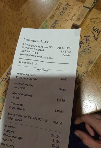 A reciept from a restaurant showing a total of $45.97 for dinner and beer.