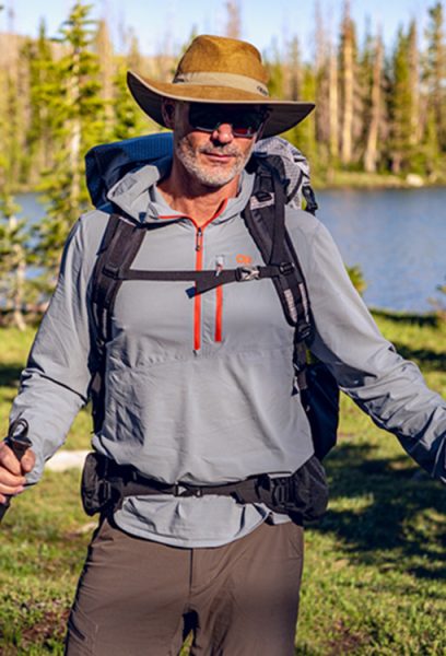 A backpacker amed Ryan is wearing a backpack with J-strap shoulder straps.