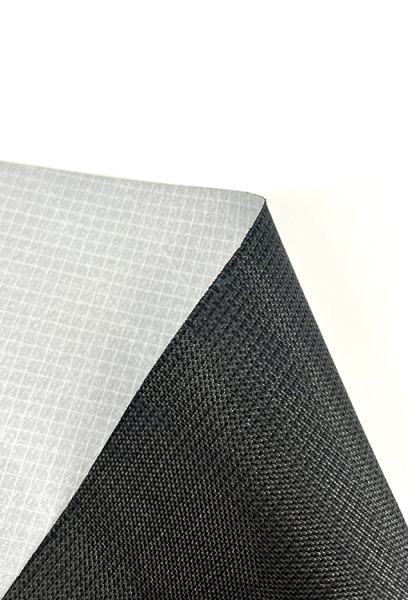 A close up view of the ULTRA 400TX Fabric back (showing grey diamond grid lines) and front. The back is white, and the front is black.