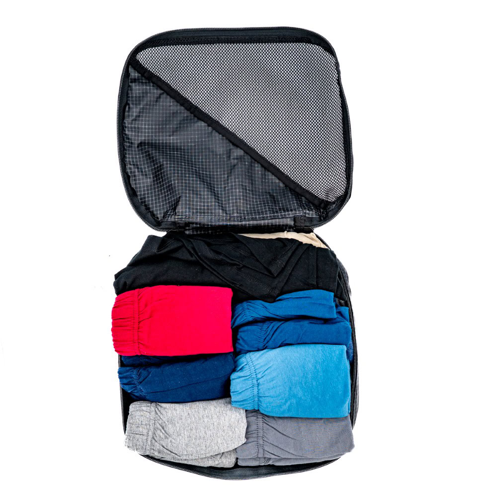 ULA Packing Cube open and packed with clothing. A t-shirt and 6 pairs of underwear/shorts are visible.