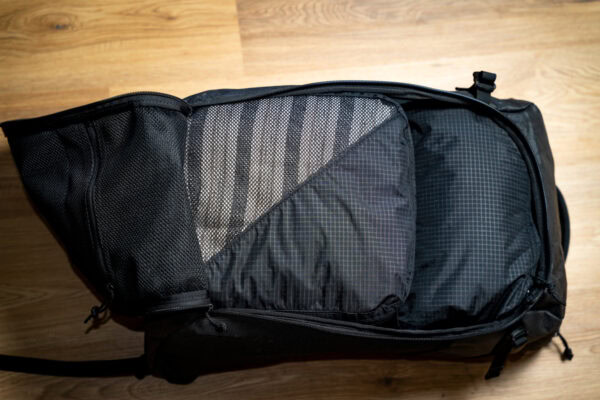 An open 36L ULA Dragonfly with a bundle of fully packed ULA packing cubes (2 large and 1 shoe cube) inside it to show how they are a perfect fit.