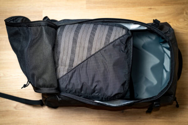 An open ULA Dragonfly with a fully packed ULA packing cube in it to show how they are a compatible size.