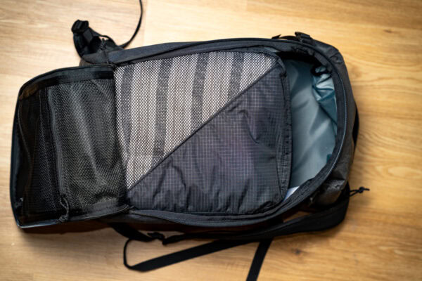 An open 30L ULA Dragonfly with a bundle of fully packed ULA packing cubes (2 large) inside it to show how they are a perfect fit.