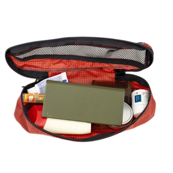 ULA Small Packing Cube in Dark Chili. Cube holds a handful of toiletries.