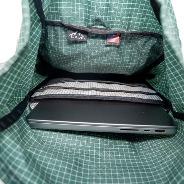 ULA Green Robic Node Daypack Internal View showing static padded laptop sleeve, mesch pocket, and main compartment.