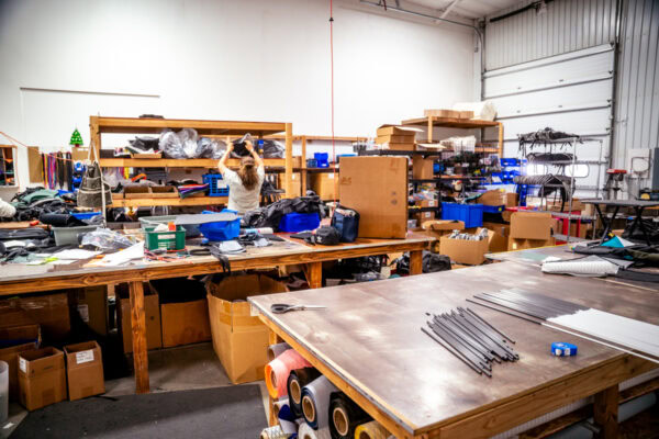 The cutting area of our production floor in Logan, Utah, USA. Alma, a vital team member, works in the background.