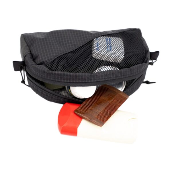 The ULA Toiltry kit on its side with toiletries spilling out.