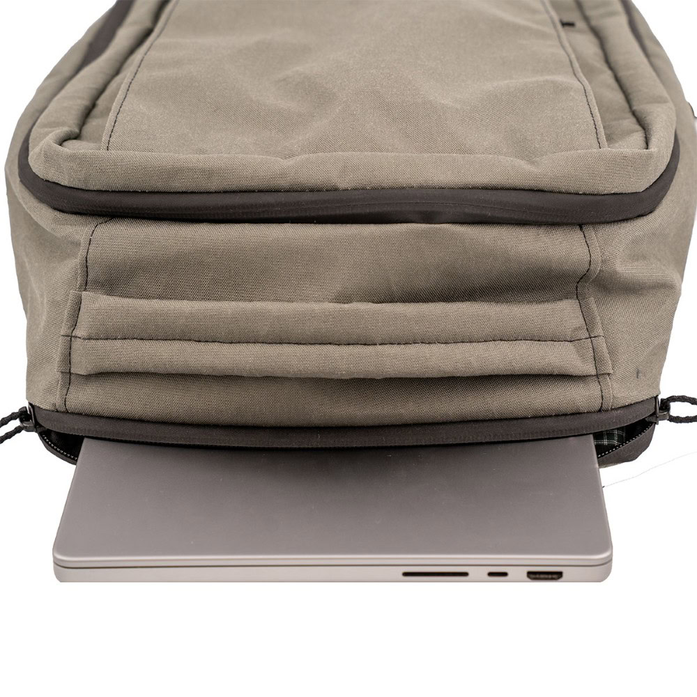X50 Cicada Daypack laptop sleeve with laptop sticking out