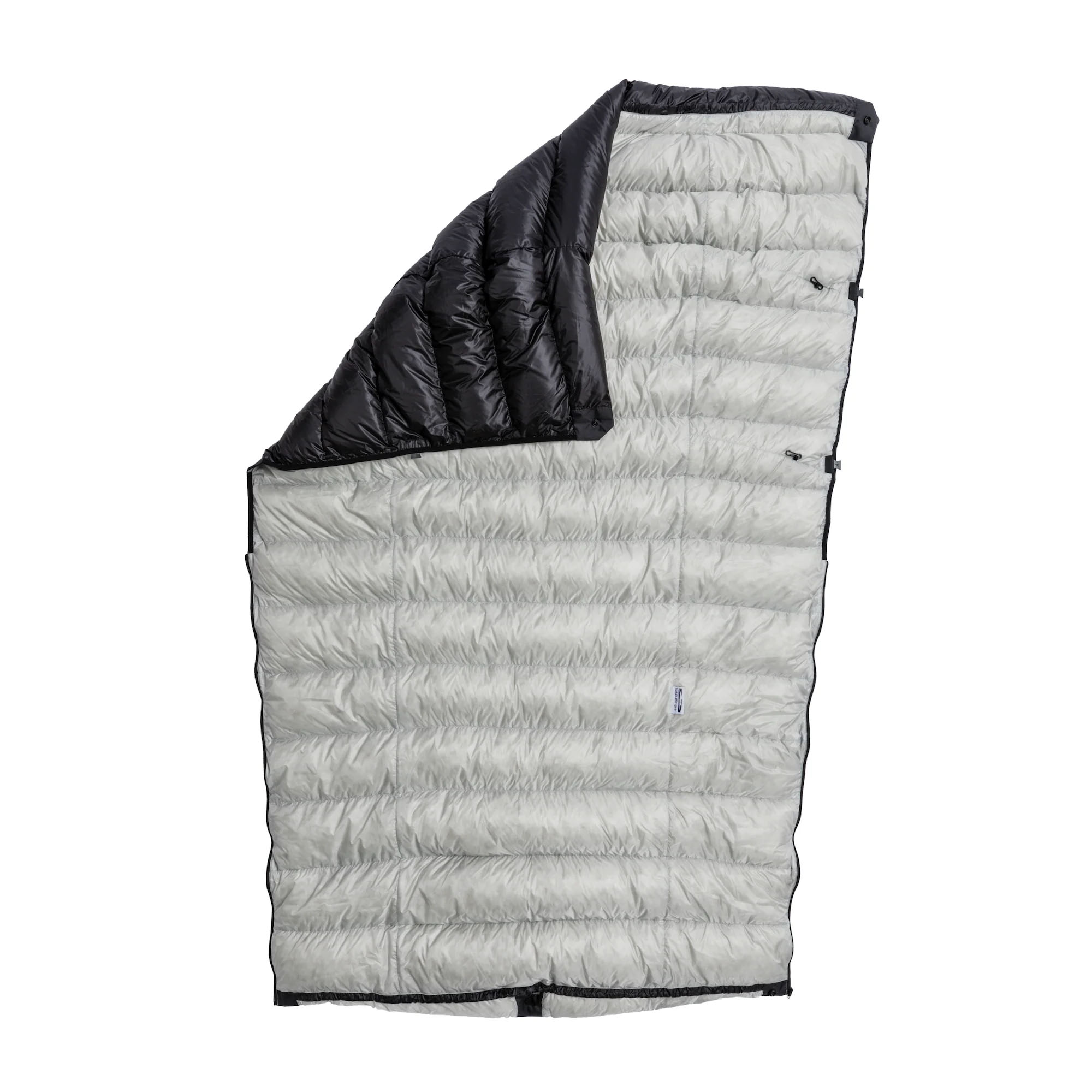 an opened up sleeping quilt